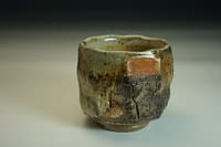 No. 20. Wood fired-chawan tea bowl, sculptured surface using glazes and oxides.