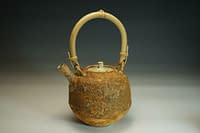 Stoneware teapot with earth textured surface