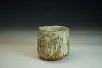 Wood-fired Chawan tea bowl. Sculptured surface with glaze and salt.