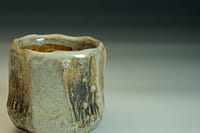 Beautiful wood-fired chawan tea bowl in stoneware, with a shino glaze. Interesting outer surface wood fired with salt.