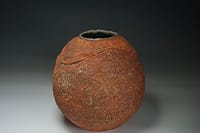 bulbous vase with cut, and sea shell impression