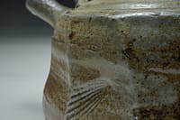 Wood salt fired teapot, cut sided surface. Heavy salt-glazed surface with sea shell indentation.