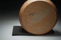 Textured surface bowl with tenmoku glaze